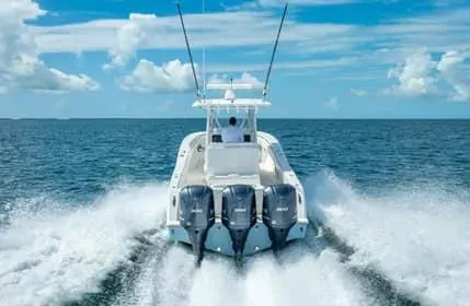 Slide: The Image of 2019 Invincible 36 Open Fisherman speeding on open ocean waters. - 37