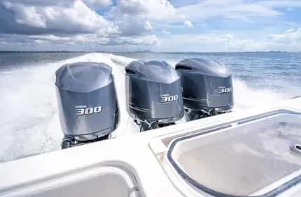 Slide: The Image of 2019 Invincible 36 Open Fisherman with triple 300 horsepower engines on open water. - 38