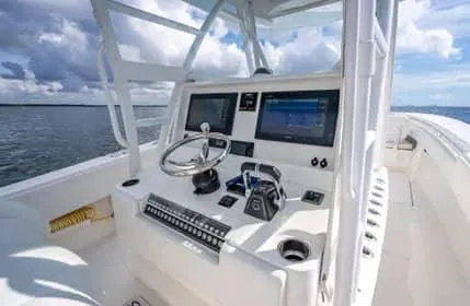Slide: The Image of 2019 Invincible 36 Open Fisherman boat console with dual screens and steering wheel. - 39