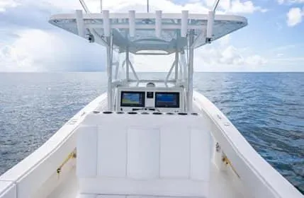Slide: The Image of 2019 Invincible 36 Open Fisherman boat on open sea, featuring modern navigation equipment. - 40