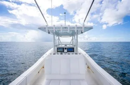 Slide: The Image of 2019 Invincible 36 Open Fisherman boat on open sea under blue sky. - 44