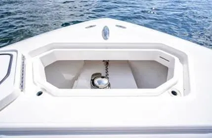 Slide: The Image of 2019 Invincible 36 Open Fisherman anchor locker on calm water. - 46