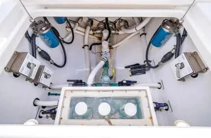 Slide: The Image of 2019 Invincible 36 Open Fisherman boat plumbing system with filters and pipes. - 47