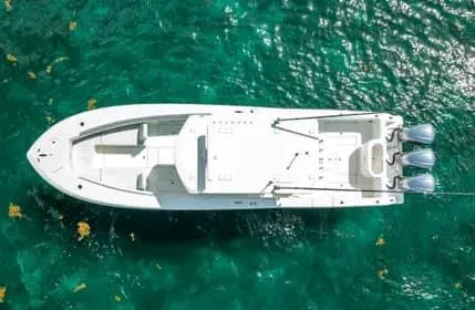 Slide: The Image of Aerial view of 2019 Invincible 36 Open Fisherman boat on clear turquoise water. - 5