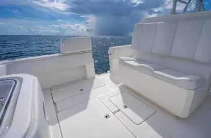 Slide: The Image of Invincible 36 Open Fisherman 2019 boat interior with white seating, ocean view. - 7
