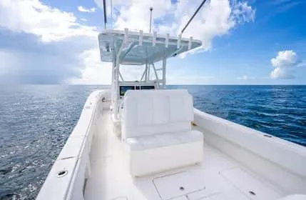 Slide: The Image of 2019 Invincible 36 Open Fisherman boat on open sea under blue sky. - 9