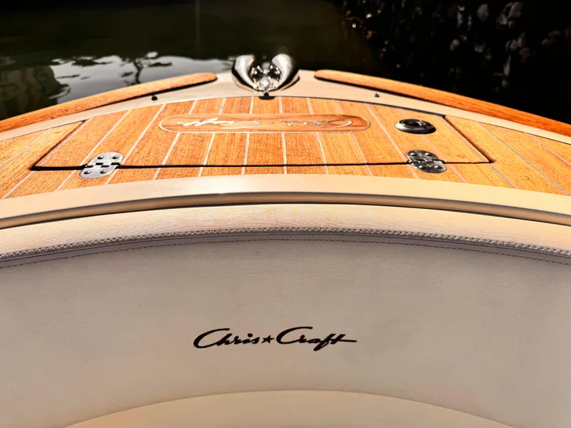 Slide: The Image of 2014 Chris-Craft Launch 25 boat with wooden deck and logo detail. - 13