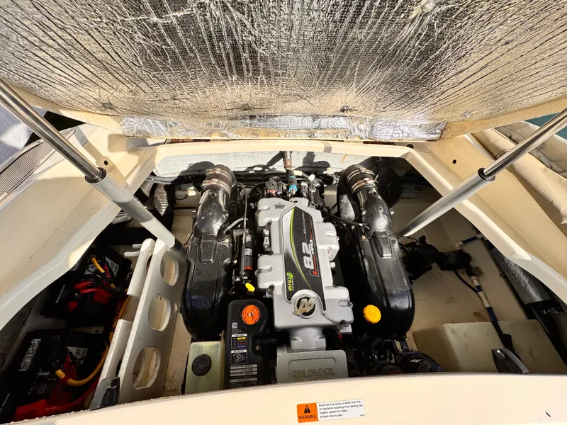 Slide: The Image of 2014 Chris-Craft Launch 25 engine compartment with MerCruiser 8.2L engine. - 15