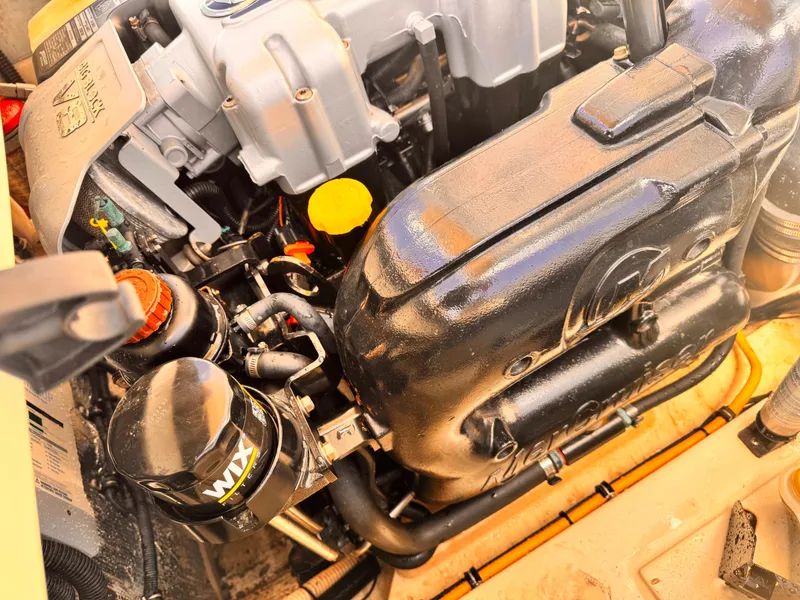 Slide: The Image of Engine of 2014 Chris-Craft Launch 25 boat, featuring detailed components and parts. - 16