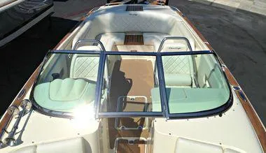 Slide: The Image of 2014 Chris-Craft Launch 25 boat interior with white seating and windshield. - 3