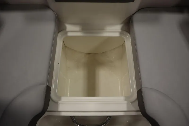Slide: The Image of 2024 Bayliner 2050 DX storage compartment, open and empty. - 15