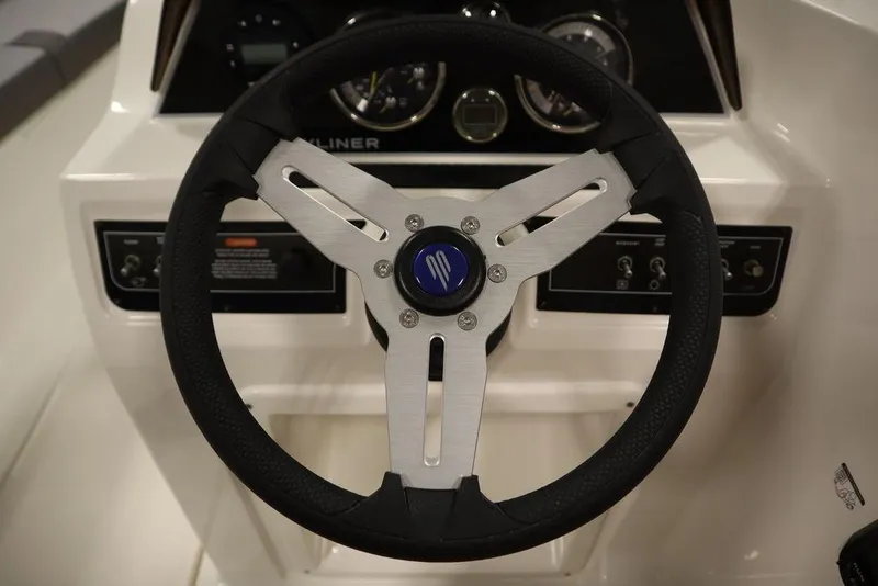 Slide: The Image of 2024 Bayliner 2050 DX steering wheel and dashboard close-up. - 23