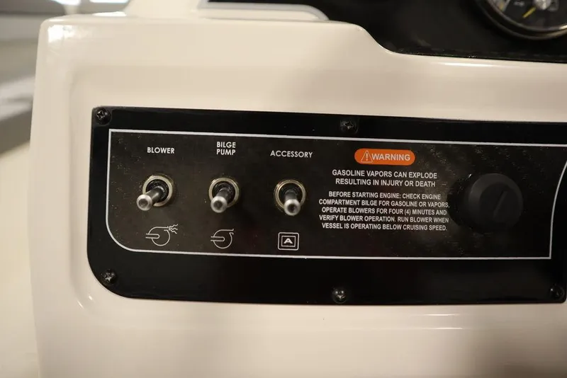 Slide: The Image of Control panel of 2024 Bayliner 2050 DX with blower, bilge pump, and accessory switches. - 26