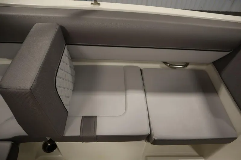 Slide: The Image of 2024 Bayliner 2050 DX interior seating with gray upholstery. - 38