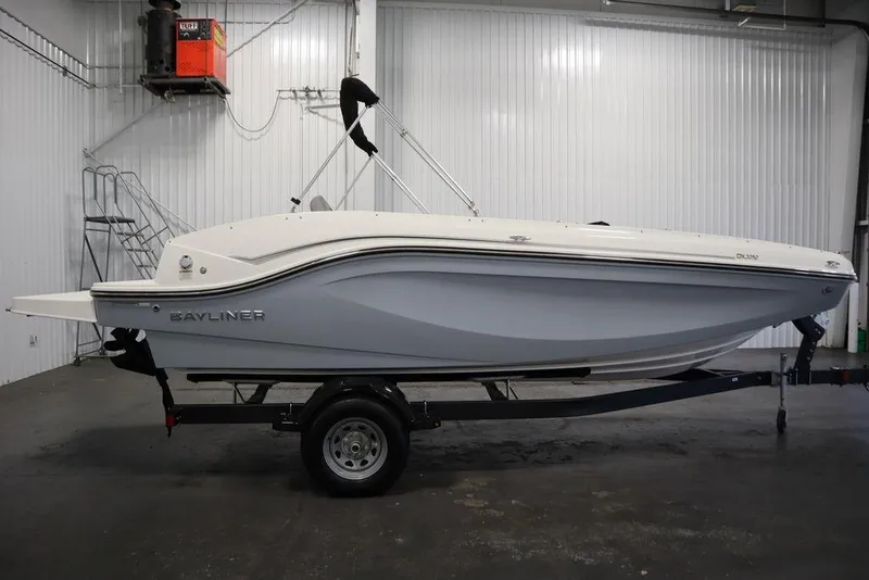 Slide: The Image of 2024 Bayliner 2050 DX boat on trailer in indoor storage. - 4