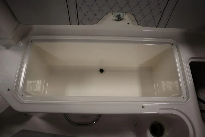 Slide: The Image of 2024 Bayliner 2050 DX boat interior storage compartment. - 44