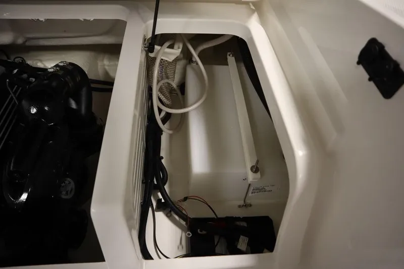 Slide: The Image of 2024 Bayliner 2050 DX engine compartment with visible components and wiring. - 47