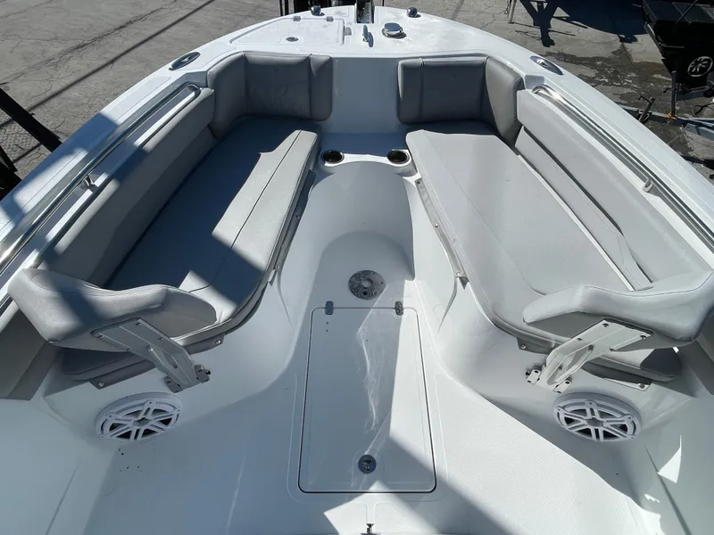 Slide: The Image of 2023 Wellcraft 222 Fisherman boat interior with cushioned seating and storage compartments. - 15