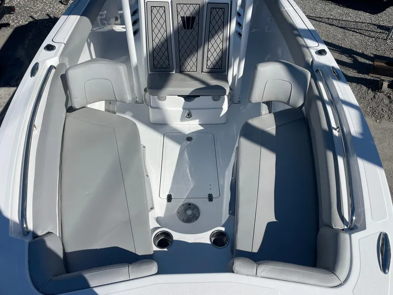 Slide: The Image of 2023 Wellcraft 222 Fisherman boat interior with gray seating and storage compartments. - 17