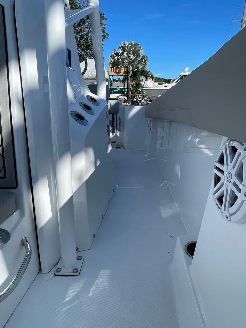 Slide: The Image of 2023 Wellcraft 222 Fisherman boat deck with control panel and speaker. - 22
