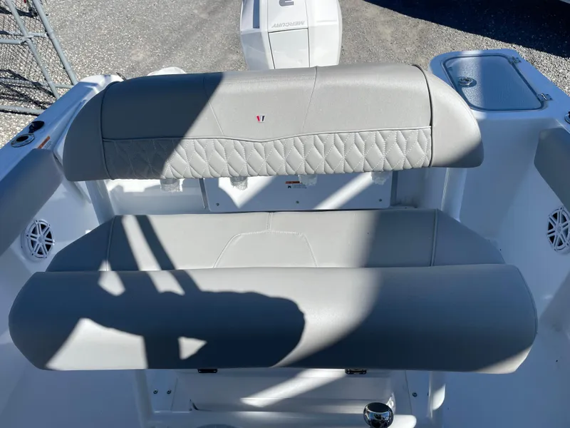 Slide: The Image of 2023 Wellcraft 222 Fisherman boat seating with gray upholstery and modern design. - 7