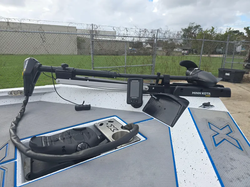 Slide: The Image of 2022 Xpress H18 boat with Minn Kota trolling motor and control panel. - 11