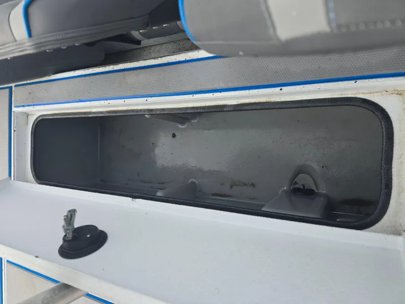 Slide: The Image of Open storage compartment in 2022 Xpress H18 boat interior. - 13