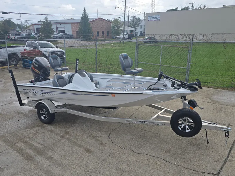 Slide: The Image of 2022 Xpress H18 boat on trailer, parked outdoors, featuring sleek design and modern seating. - 3