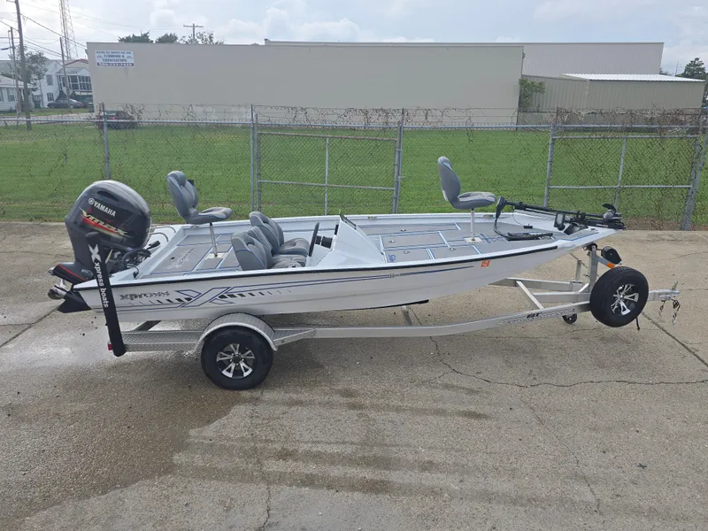 Slide: The Image of 2022 Xpress H18 boat on trailer with Yamaha outboard motor. - 4