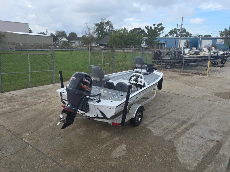 Slide: The Image of 2022 Xpress H18 boat with motor on trailer in fenced area. - 5