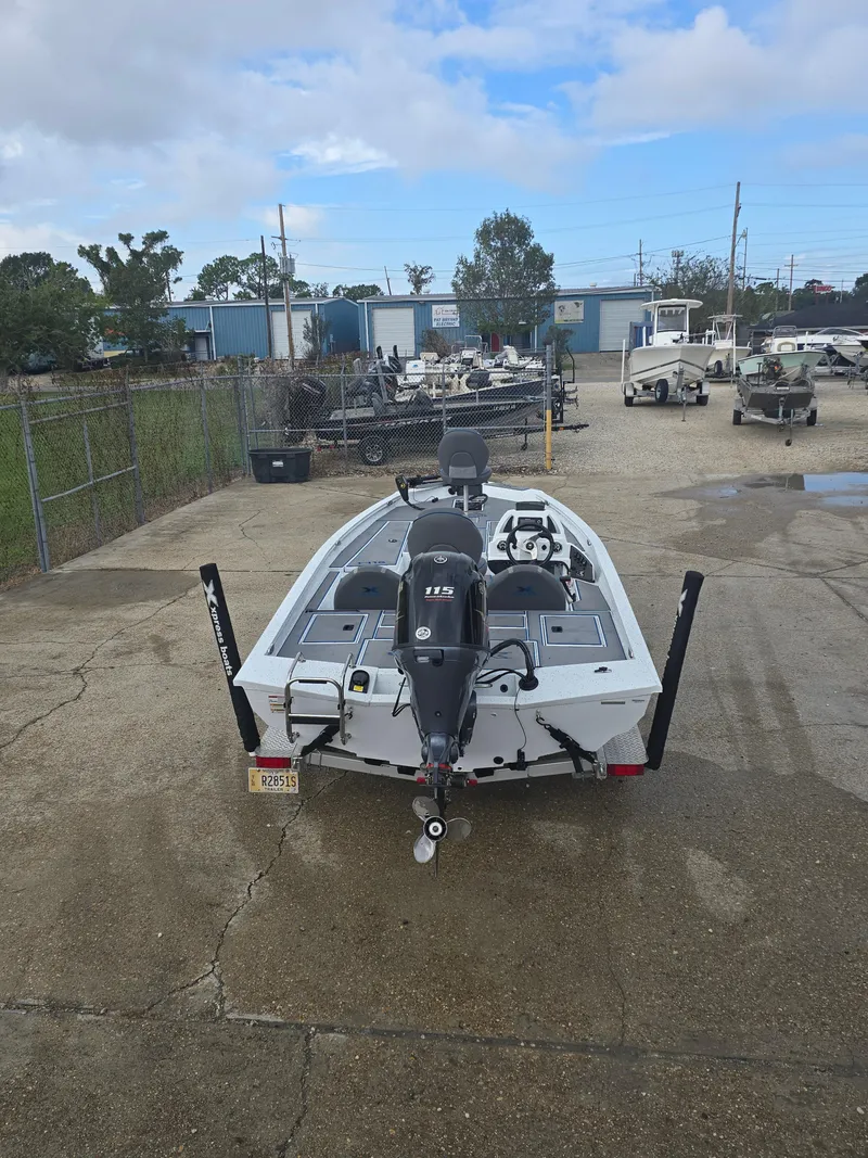 Slide: The Image of 2022 Xpress H18 boat with motor in a storage yard. - 6