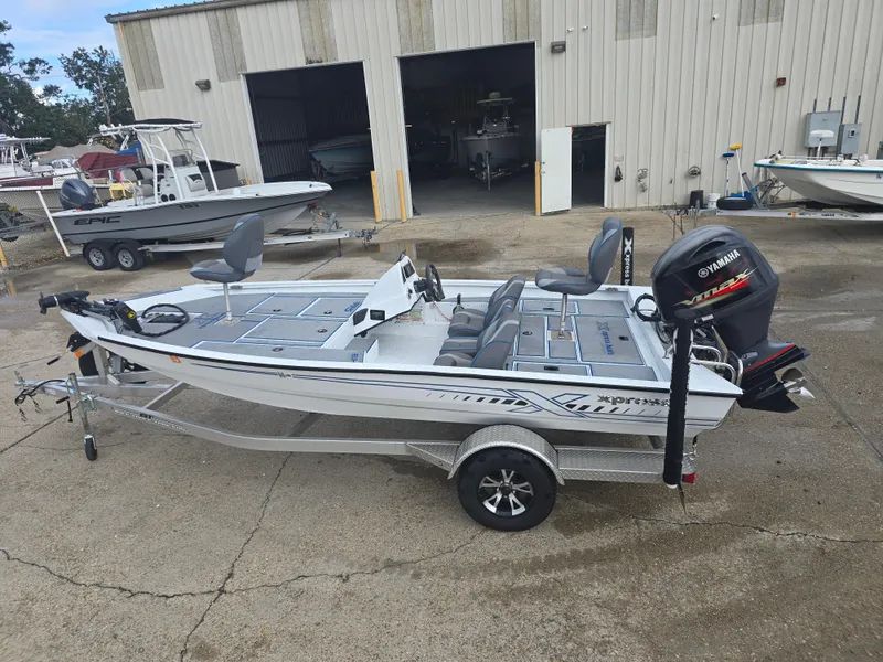 Slide: The Image of 2022 Xpress H18 boat with Yamaha outboard motor in a marina setting. - 8