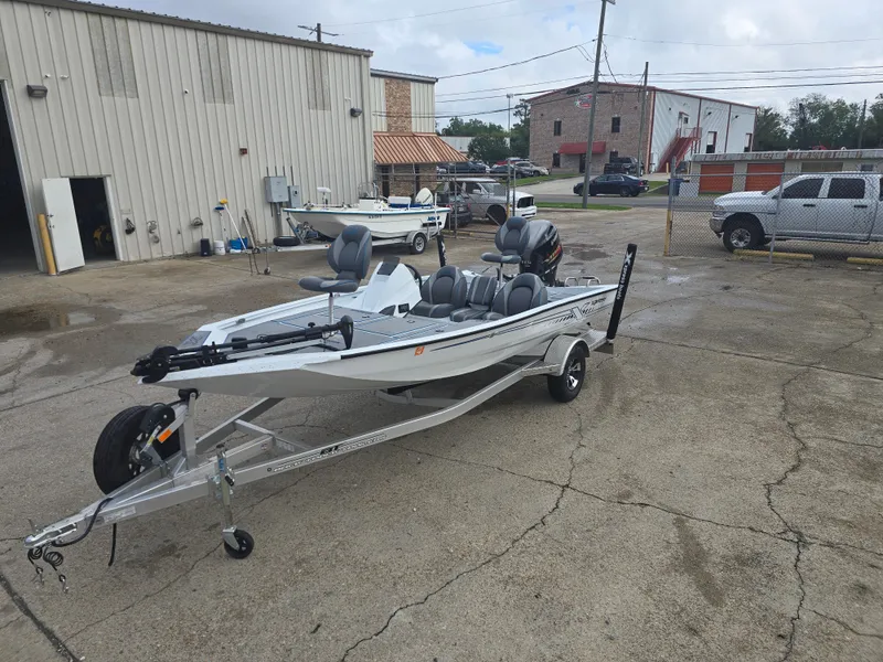 Slide: The Image of 2022 Xpress H18 boat on trailer in industrial lot. - 9