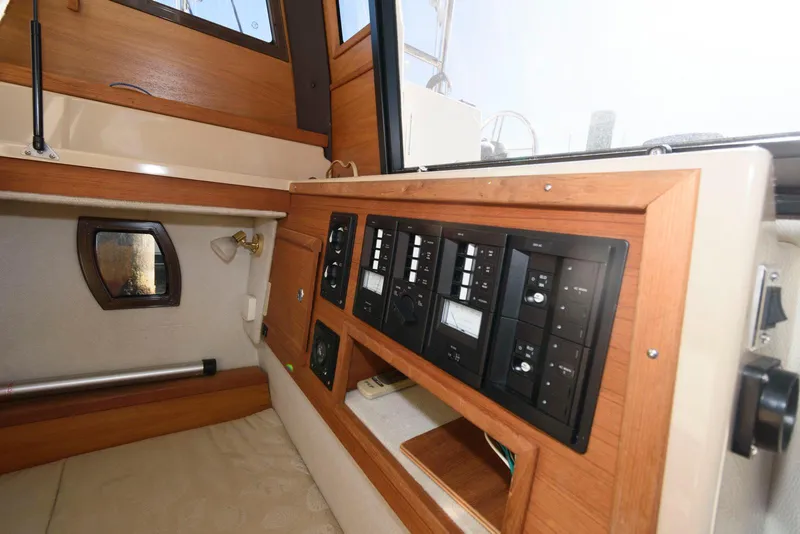 Slide: The Image of Interior view of 2015 Ranger Tugs R-29S with control panel and wooden accents. - 30