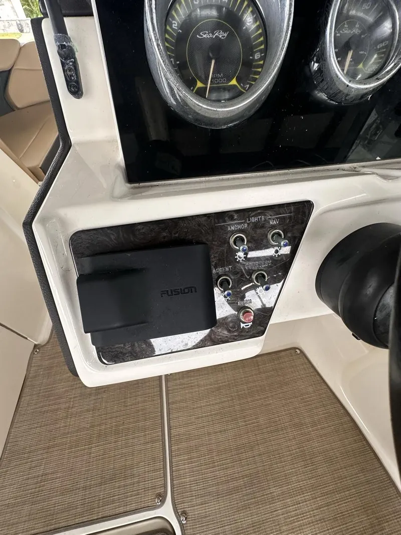 Slide: The Image of 2019 Sea Ray SPX 230 OB dashboard with gauges and controls. - 15