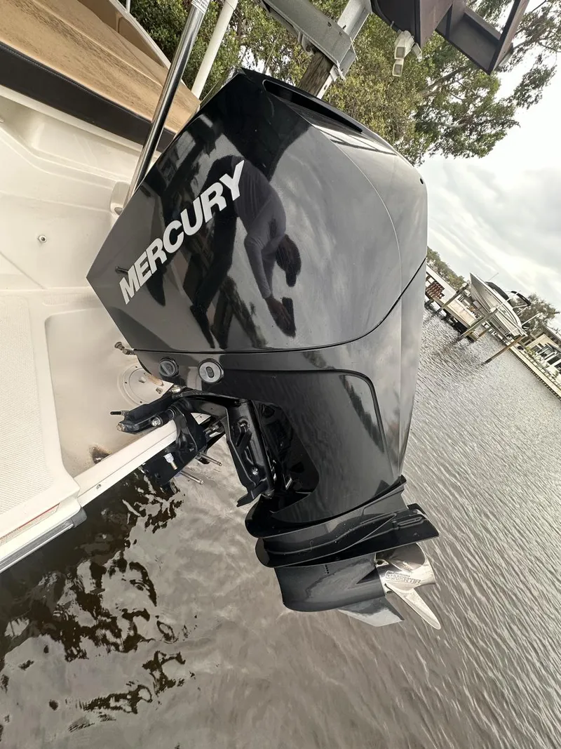 Slide: The Image of 2019 Sea Ray SPX 230 OB with Mercury outboard engine on a calm waterway. - 25