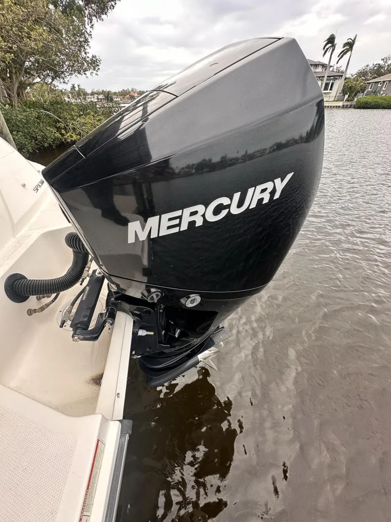 Slide: The Image of Mercury outboard engine on 2019 Sea Ray SPX 230 OB boat by the water. - 35