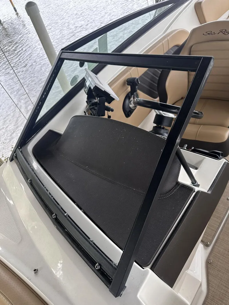 Slide: The Image of 2019 Sea Ray SPX 230 OB boat dashboard and steering wheel. - 36