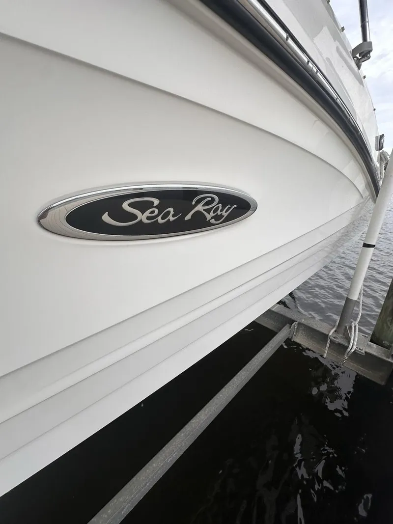 Slide: The Image of 2019 Sea Ray SPX 230 OB boat side view with logo. - 39