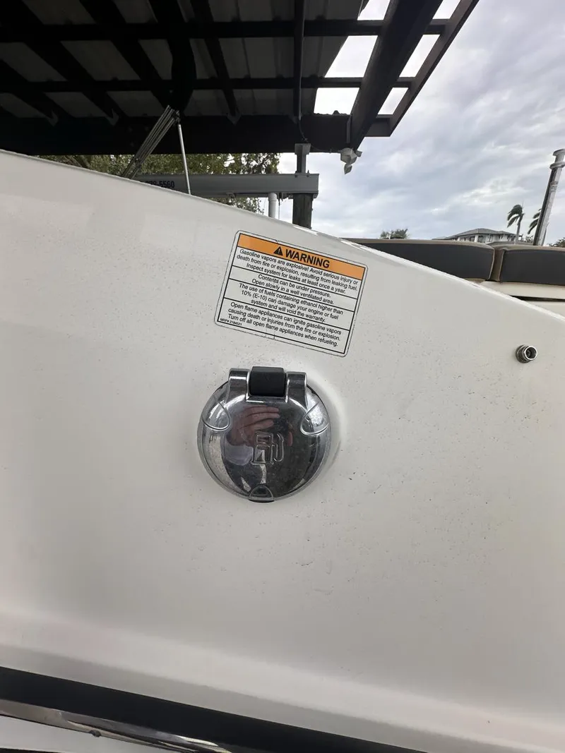 Slide: The Image of 2019 Sea Ray SPX 230 OB boat fuel cap with warning label. - 42