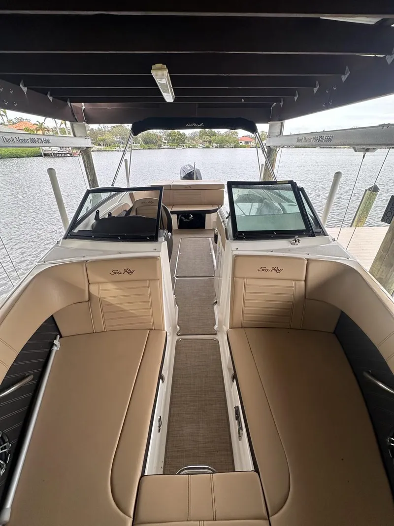 Slide: The Image of 2019 Sea Ray SPX 230 OB boat interior with tan seating and open deck. - 6