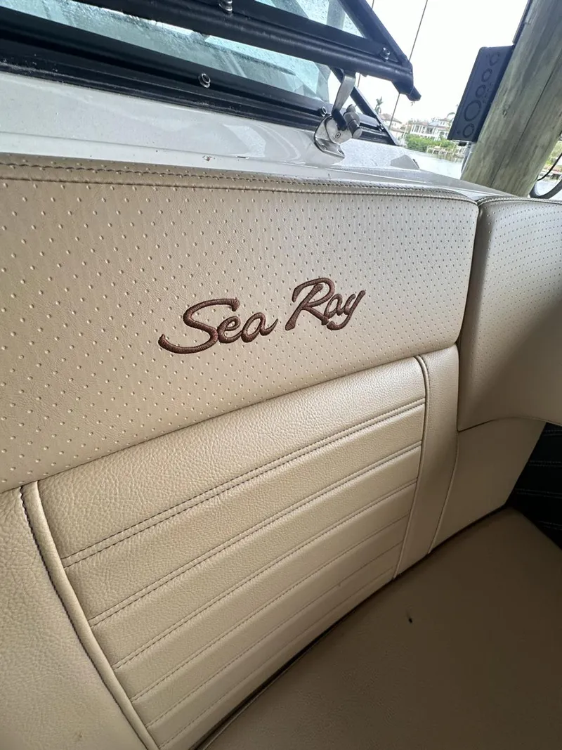 Slide: The Image of Close-up of 2019 Sea Ray SPX 230 OB boat interior with logo. - 8