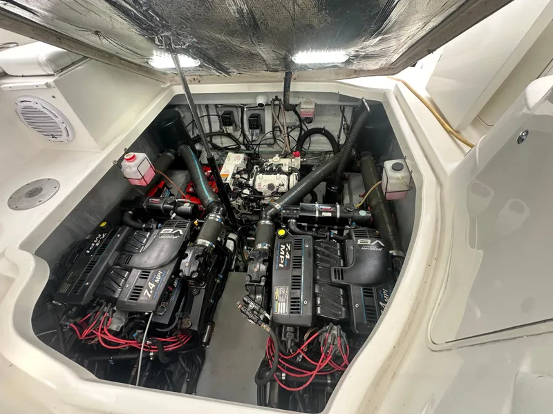 Slide: The Image of 2001 Wellcraft 3300 Martinique engine compartment with dual engines and wiring. - 10