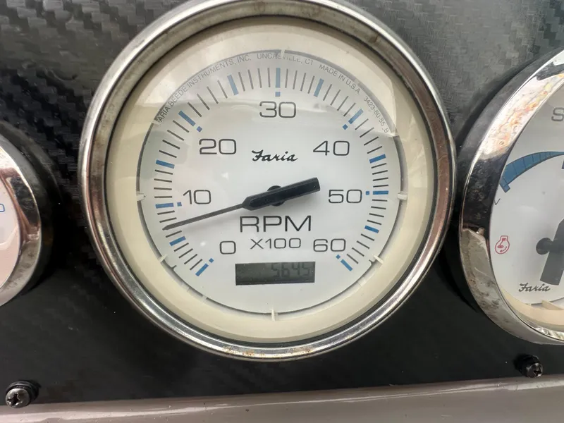 Slide: The Image of Close-up of a 2001 Wellcraft 3300 Martinique RPM gauge displaying 545 hours. - 12