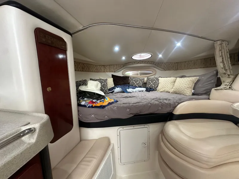 Slide: The Image of Interior cabin of 2001 Wellcraft 3300 Martinique with cozy bed and seating area. - 19