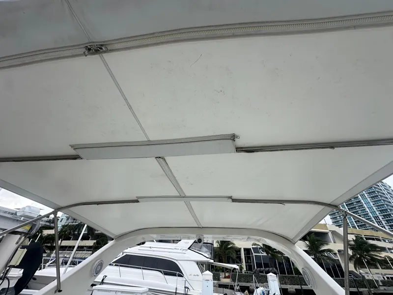 Slide: The Image of 2001 Wellcraft 3300 Martinique boat canopy view at marina. - 23