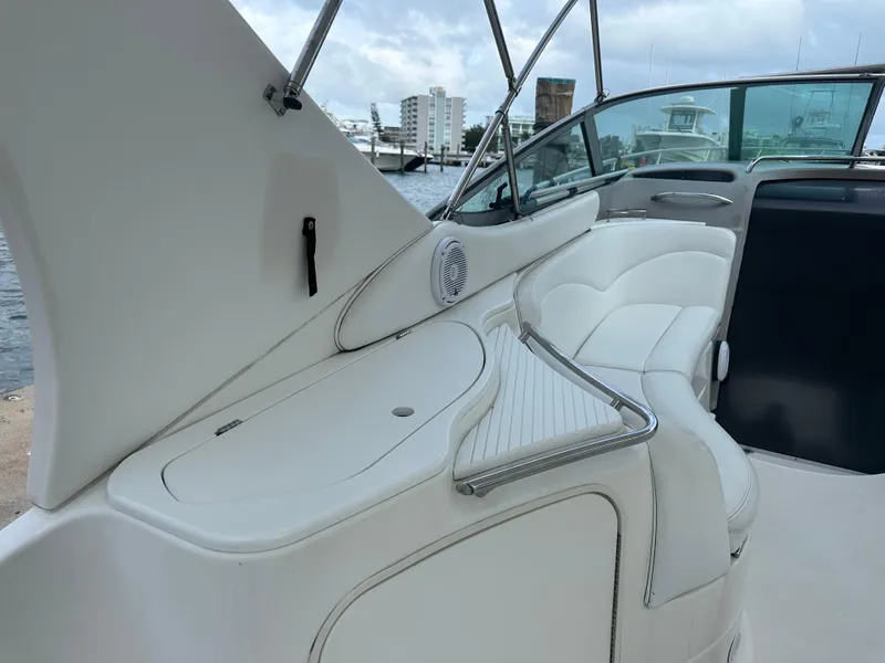 Slide: The Image of 2001 Wellcraft 3300 Martinique boat interior with white seating and waterfront view. - 6