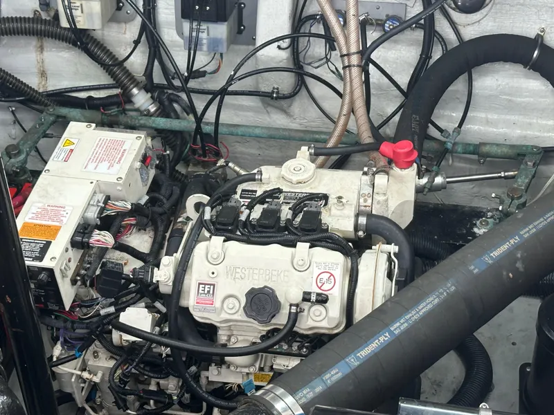 Slide: The Image of Engine compartment of 2001 Wellcraft 3300 Martinique boat, featuring Westerbeke generator. - 9