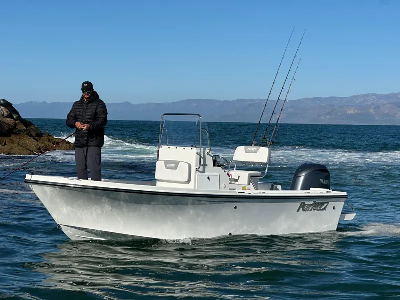 The Image of 2024 Parker 18SE Center Console boat on water with person fishing. - 0