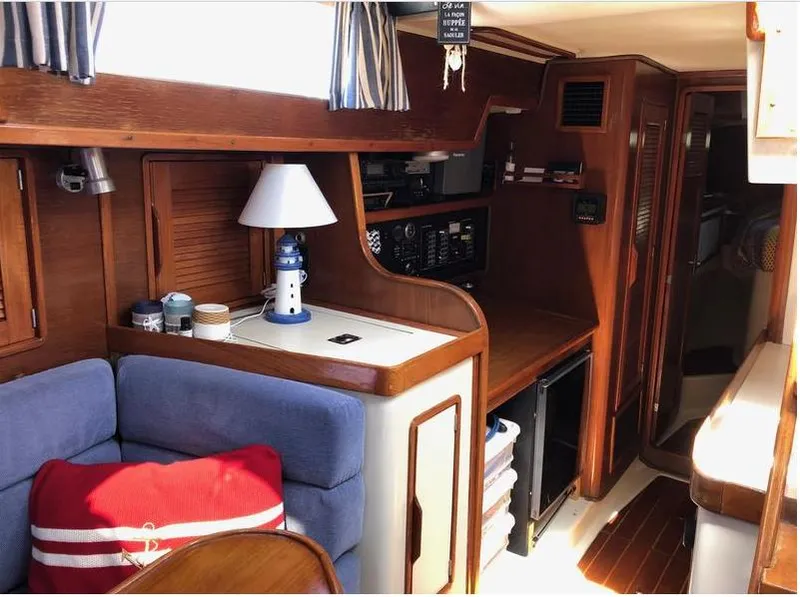 Slide: The Image of Interior of 1987 Irwin MKII sailboat with cozy seating and nautical decor. - 20